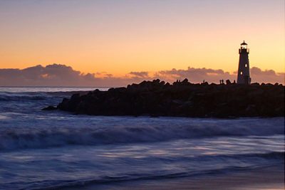 Lighthouse at sunset near beach