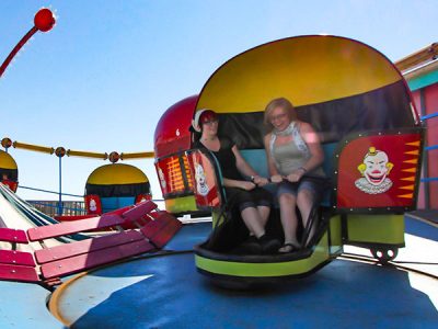 Two women on Riptide seaside park ride