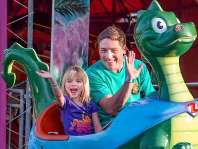 Father and daughter on Sea Dragons ride