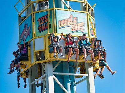 People riding Double Shot seaside park ride