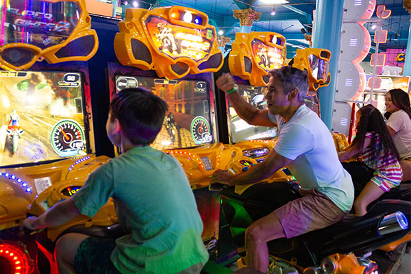 family playing arcade games
